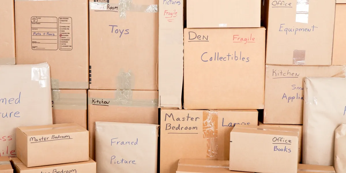 Moving boxes stacked in a new home